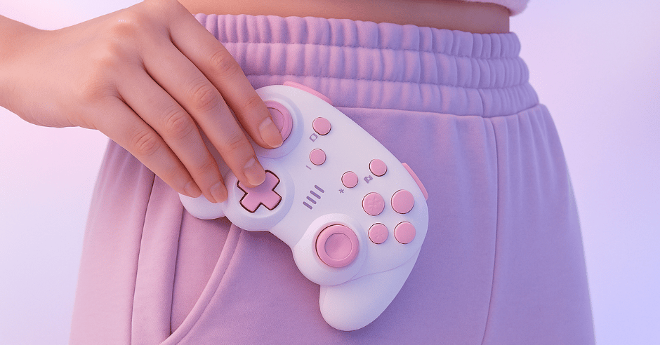 Person holding a pink and white gaming controller against a light purple background